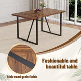 A minimalist retro rectangular dining table with a specially textured top and black metal W1151P240748
