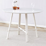 A modern minimalist circular dining table with a 42 inch diameter white patterned tabletop and white W1151P152778