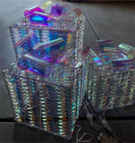 3 glowing Christmas gift boxes with bows 04567105