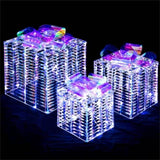 3 glowing Christmas gift boxes with bows 04567105