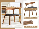 2 walnut colored solid wood dining chairs, with black PU soft cushions and curved backrests that fit W1151P436187