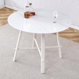 A modern minimalist circular dining table with a 42 inch diameter white patterned tabletop and white W1151P152778