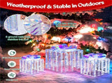 3 glowing Christmas gift boxes with bows 04567105