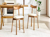 2 walnut colored solid wood dining chairs, with white PU soft cushions and curved backrests that fit W1512P510307
